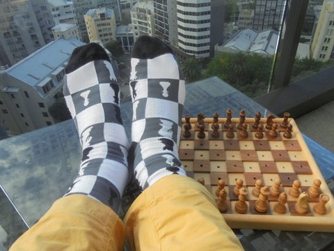 Feet up on chess board